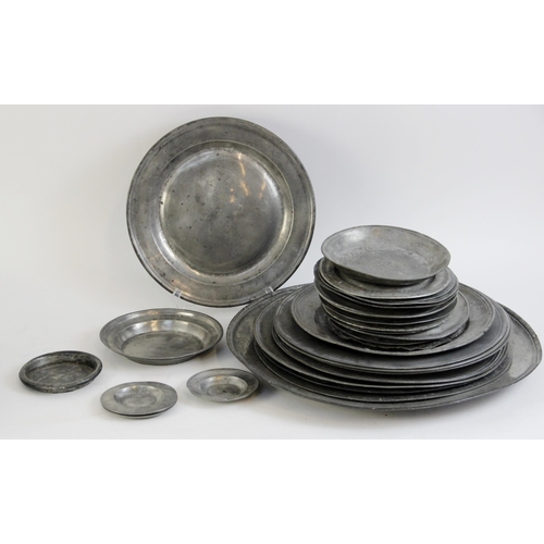 391 - A large selection of 17th century and later pewter chargers, including a large example with touch ma... 