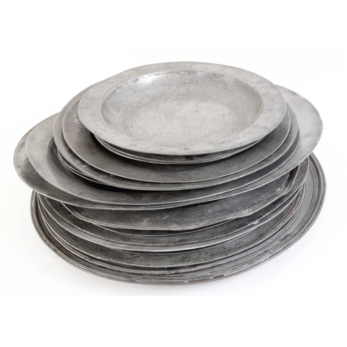 391 - A large selection of 17th century and later pewter chargers, including a large example with touch ma... 