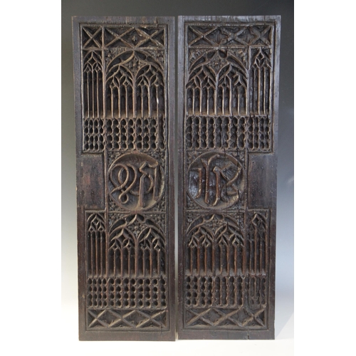 401 - A pair of tracery and christogram type carved panels, circa 1500, elaborately and intricately carved... 