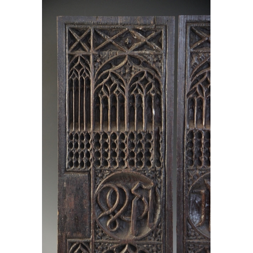 401 - A pair of tracery and christogram type carved panels, circa 1500, elaborately and intricately carved... 