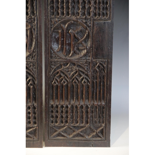 401 - A pair of tracery and christogram type carved panels, circa 1500, elaborately and intricately carved... 