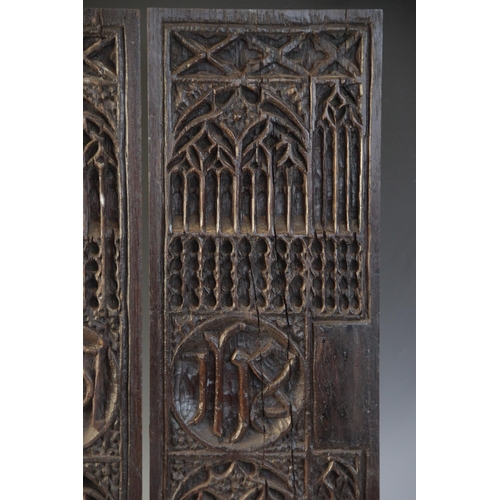 401 - A pair of tracery and christogram type carved panels, circa 1500, elaborately and intricately carved... 