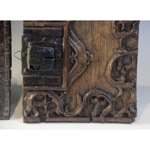 402 - An early 16th century iron lock plate, mounted on a carved oak panel, 19cm x 25.5cm, with a further ... 