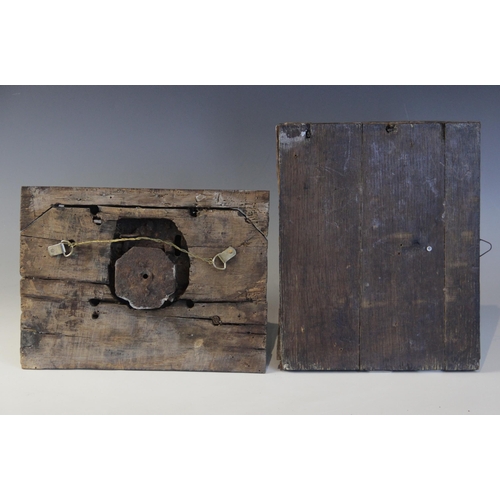 402 - An early 16th century iron lock plate, mounted on a carved oak panel, 19cm x 25.5cm, with a further ... 