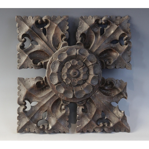 407 - A late 15th century oak ceiling/roof boss, of square leafy quatrefoil form, centred by a Tudor rose,... 