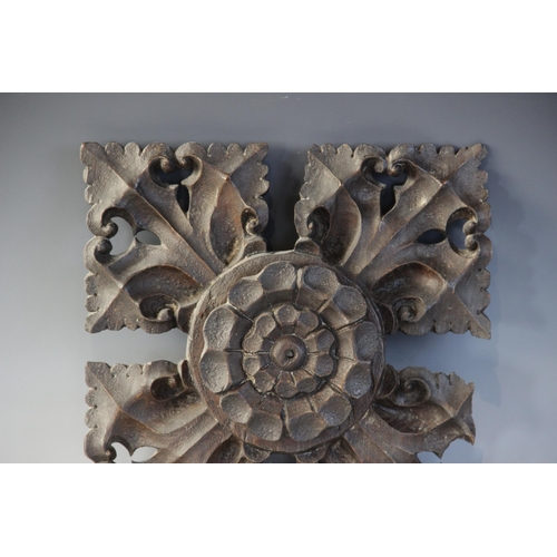 407 - A late 15th century oak ceiling/roof boss, of square leafy quatrefoil form, centred by a Tudor rose,... 