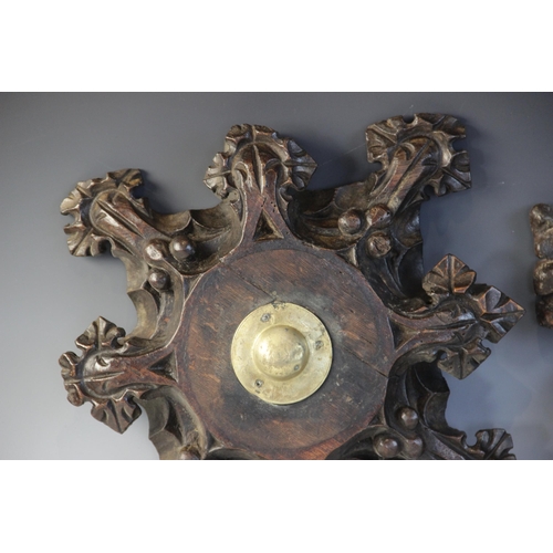 408 - Two late 15th century oak ceiling/roof bosses of barbed quatrefoil form, each with later central bra... 