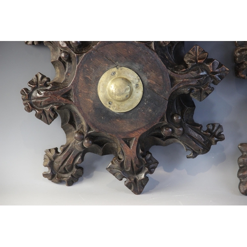 408 - Two late 15th century oak ceiling/roof bosses of barbed quatrefoil form, each with later central bra... 