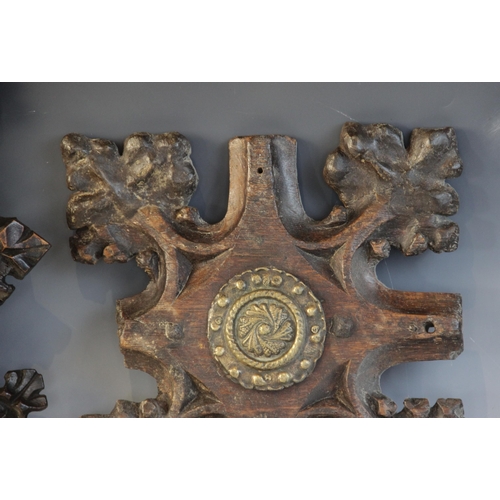 408 - Two late 15th century oak ceiling/roof bosses of barbed quatrefoil form, each with later central bra... 