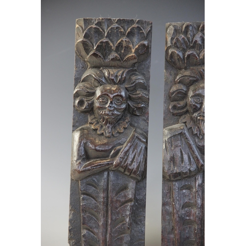 409 - A pair of late Elizabethan figural terms, each carved as a gentleman with his arm in a sling wearing... 