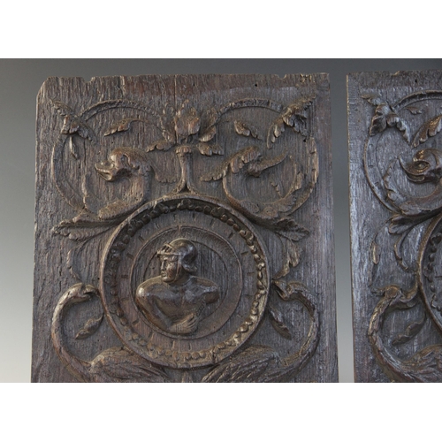 411 - A pair of oak Romayne type panels, circa 1630, one designed with a female bust, the other with a mal... 