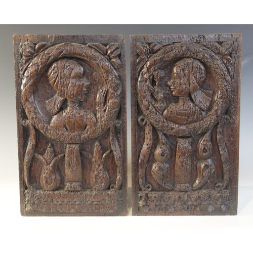 412 - A pair of oak Romayne type panels, each designed with a female holding a single flower within a laur... 