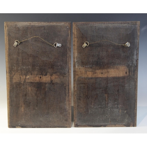 412 - A pair of oak Romayne type panels, each designed with a female holding a single flower within a laur... 