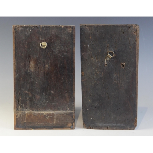 414 - A pair of 16th century oak naïve carved panels, circa 1550, each carved with a profile mask and leaf... 