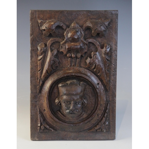 415 - A Henry VIII carved oak panel, Tudor, 15/16th century, Romayne type, carved with a male portrait wit... 