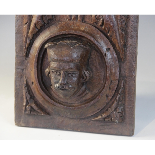 415 - A Henry VIII carved oak panel, Tudor, 15/16th century, Romayne type, carved with a male portrait wit... 