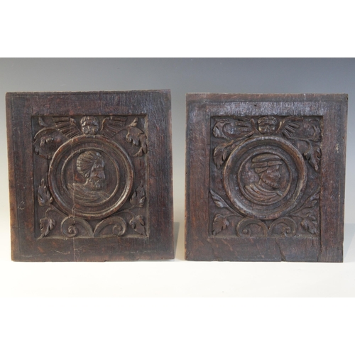 416 - A pair of 16th century carved oak Romayne type panels, Tudor, circa 1530, each carved with a male pr... 