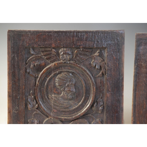 416 - A pair of 16th century carved oak Romayne type panels, Tudor, circa 1530, each carved with a male pr... 