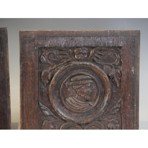 416 - A pair of 16th century carved oak Romayne type panels, Tudor, circa 1530, each carved with a male pr... 