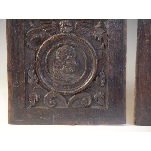 416 - A pair of 16th century carved oak Romayne type panels, Tudor, circa 1530, each carved with a male pr... 