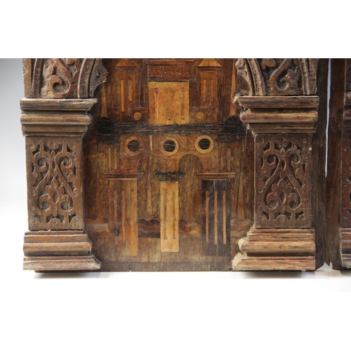 420 - A pair of Elizabeth I, Tudor, 16th century, carved oak and inlaid Nonsuch type panels, each designed... 