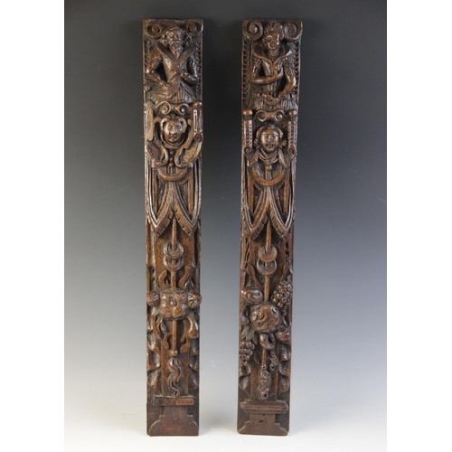 422 - A pair of carved oak terms, Flemish, circa 1600, designed with a male and female figure atop a maske... 