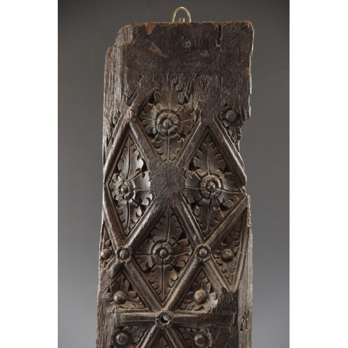 425 - A Henry VII carved oak panel, circa 1500, designed with a leaf fill lattice, 79cm x 20.5cm