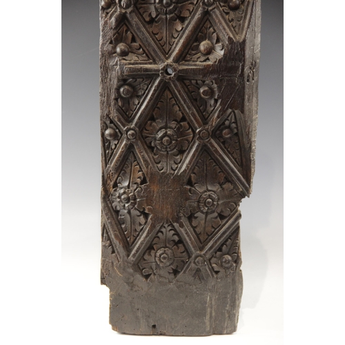 425 - A Henry VII carved oak panel, circa 1500, designed with a leaf fill lattice, 79cm x 20.5cm