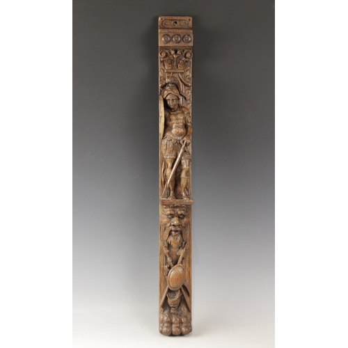 428 - An oak figural pilaster, Flemish, circa 1600, carved with a soldier with sword and shield, atop a gr... 