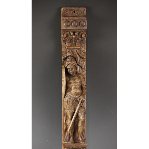 428 - An oak figural pilaster, Flemish, circa 1600, carved with a soldier with sword and shield, atop a gr... 