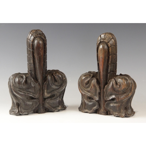 431 - A pair of late 15th century oak poppy head finials, cut from pew ends, 22cm x 15cm (2)