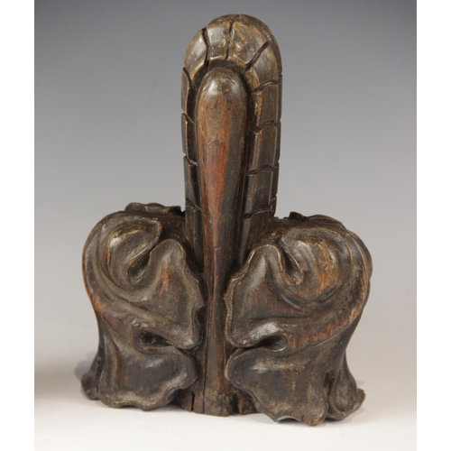 431 - A pair of late 15th century oak poppy head finials, cut from pew ends, 22cm x 15cm (2)