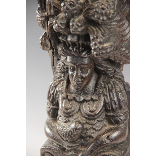 441 - An Elizabeth I carved oak figural term, circa 1590, carved in high relief as a female holding a bird... 