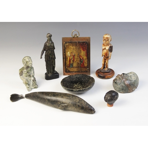 45 - A selection of carvings and objects of virtue, to include a miniature icon depicting the annunciatio... 