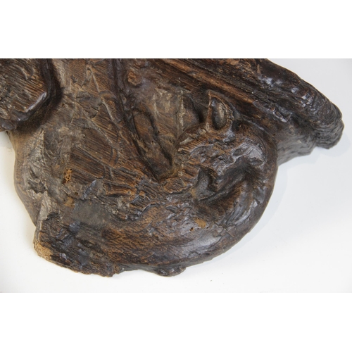 450 - A late 15th century carved oak misericord section, designed as a dragon, circa 1480, 20.5cm high x 2... 