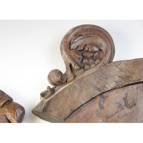 468 - A 15th century carved pew end section, carved with a grotesque bird, 22.5cm high and another similar... 