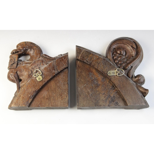 468 - A 15th century carved pew end section, carved with a grotesque bird, 22.5cm high and another similar... 