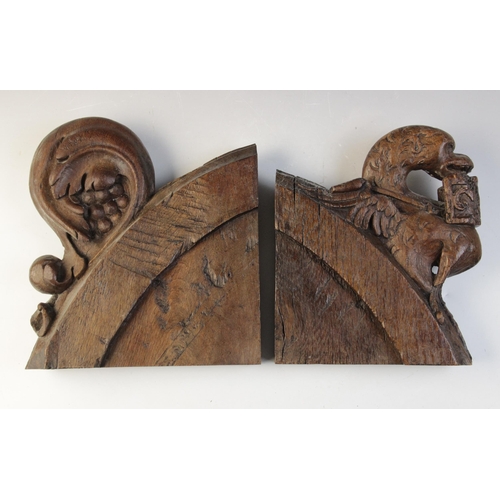 468 - A 15th century carved pew end section, carved with a grotesque bird, 22.5cm high and another similar... 