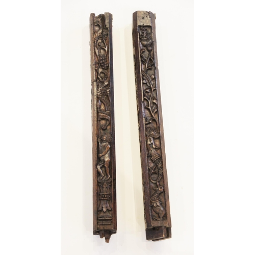 472 - A pair of carved oak pillars, possibly part bed posts, circa 1500 and later, of canted square sectio... 