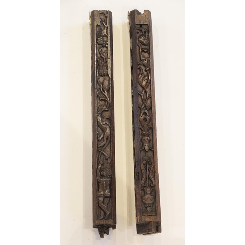 472 - A pair of carved oak pillars, possibly part bed posts, circa 1500 and later, of canted square sectio... 