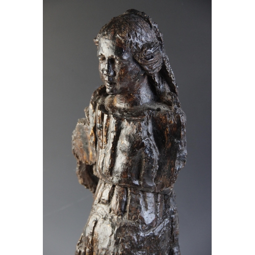 478 - A 16th century carved pine figure of a female, European, modelled standing in flowing robes, 62cm hi... 