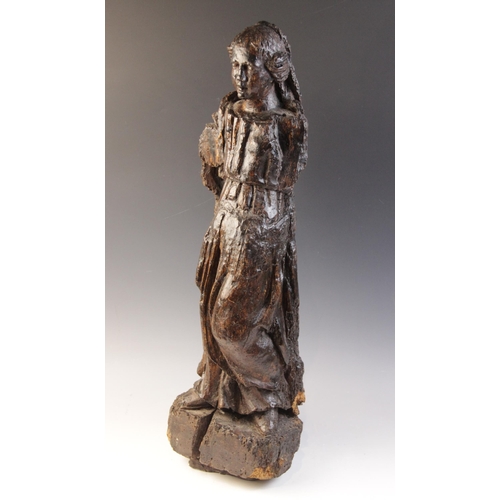 478 - A 16th century carved pine figure of a female, European, modelled standing in flowing robes, 62cm hi... 