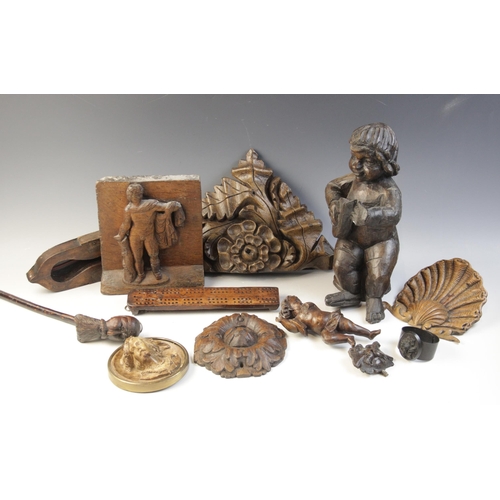 483 - A selection of carved wood items, to include a carved oak panel, carved with a figure, 21cm high, a ... 