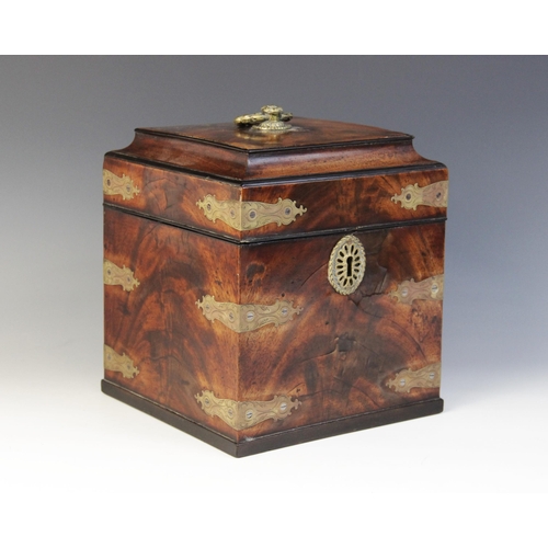 486 - A George III mahogany decanter box, the moulded square hinged cover with applied brass ring handle o... 