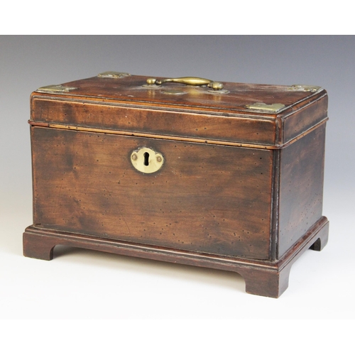 492 - A George III mahogany decanter box, the shaped brass cartouche applied with a coat of arms depiction... 