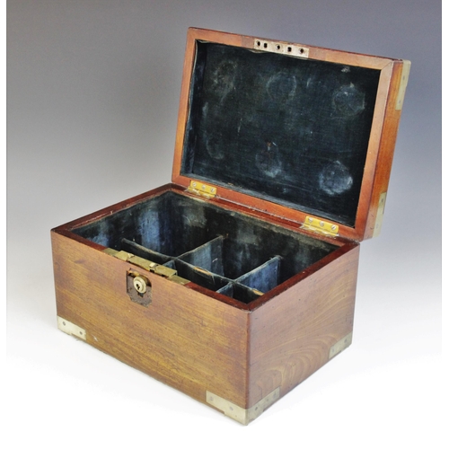 492 - A George III mahogany decanter box, the shaped brass cartouche applied with a coat of arms depiction... 