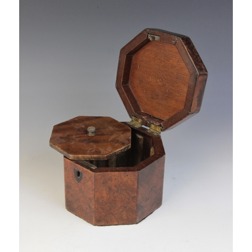 493 - A George III burr yew wood octagonal tea caddy, the hinged cover inlaid with star detail, opening to... 