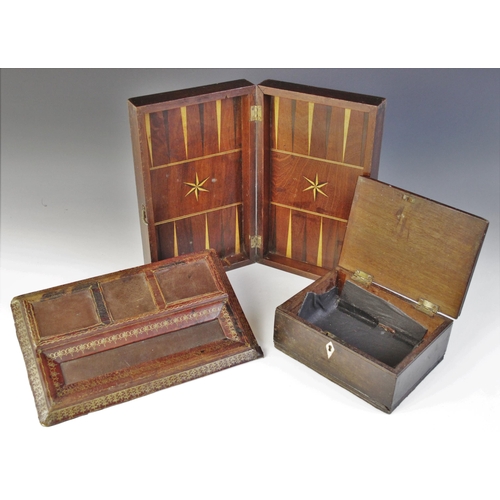 496 - A 19th century mahogany games box, the exterior inlaid with a chess board, opening to an inlaid back... 