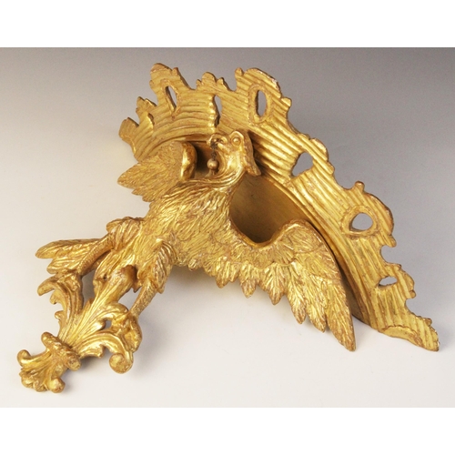 501 - A late 19th/early 20th century giltwood figural wall bracket, modelled as an eagle with wings outstr... 