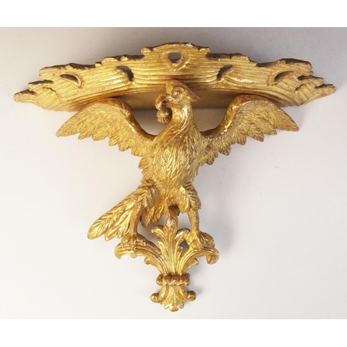 501 - A late 19th/early 20th century giltwood figural wall bracket, modelled as an eagle with wings outstr... 